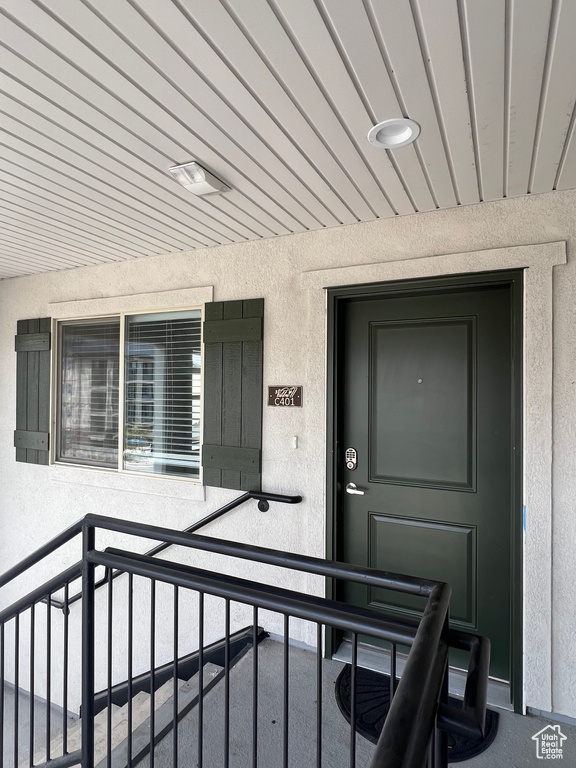 Property entrance with stucco siding