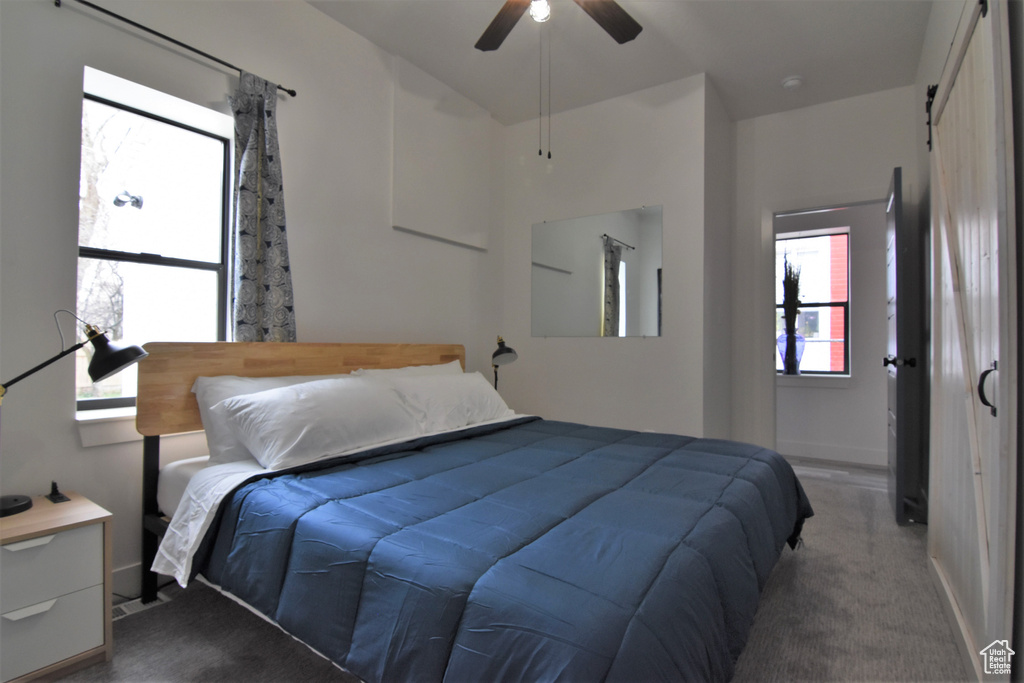 Bedroom featuring carpet floors, a ceiling fan, and baseboards