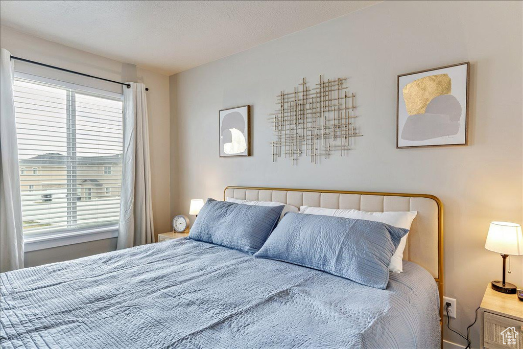 Bedroom featuring multiple windows