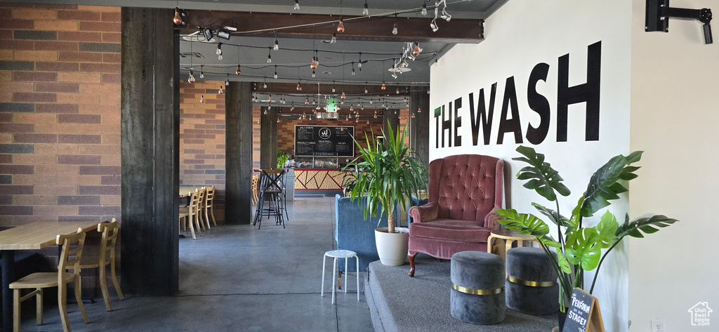 Building lobby featuring brick wall