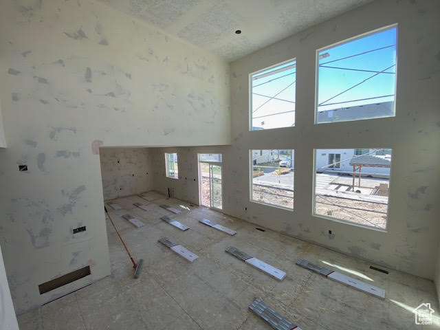 Spare room with a towering ceiling