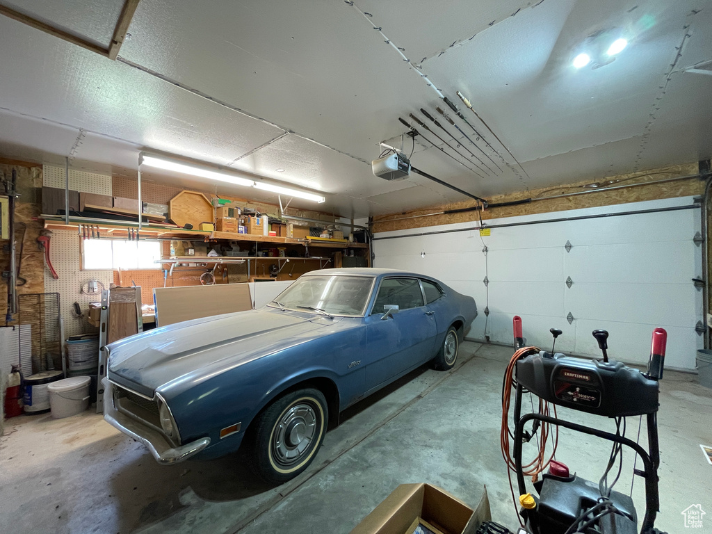 Garage featuring a garage door opener
