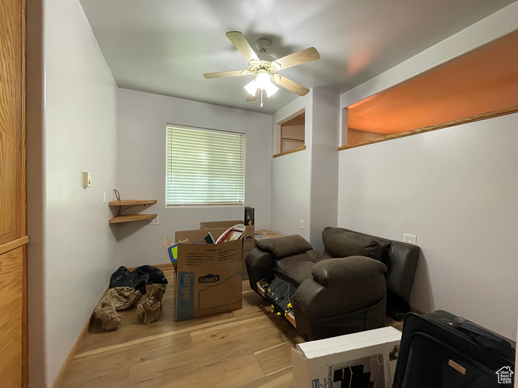 Sitting room featuring wood finished floors and ceiling fan