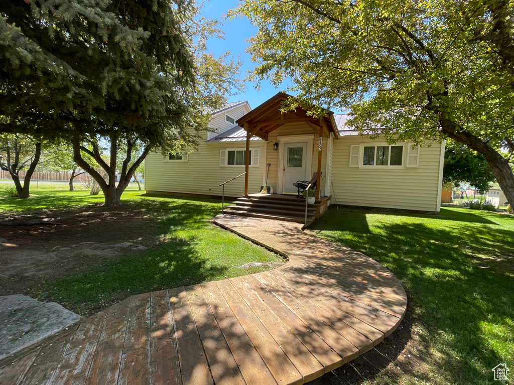 Bungalow-style house with a front lawn and metal roof