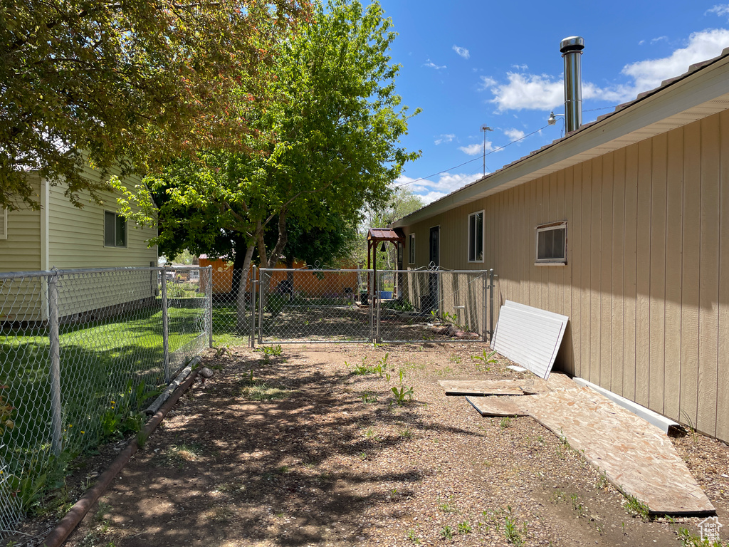 View of yard with a gate