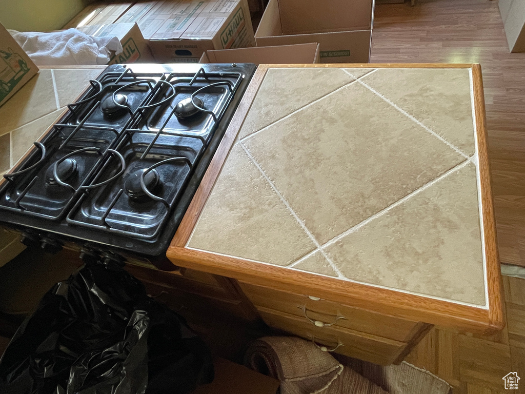 Kitchen view of wood finished floors