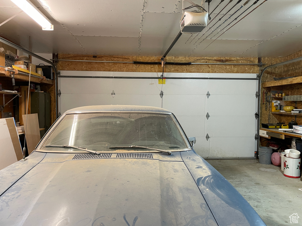 Garage featuring a garage door opener