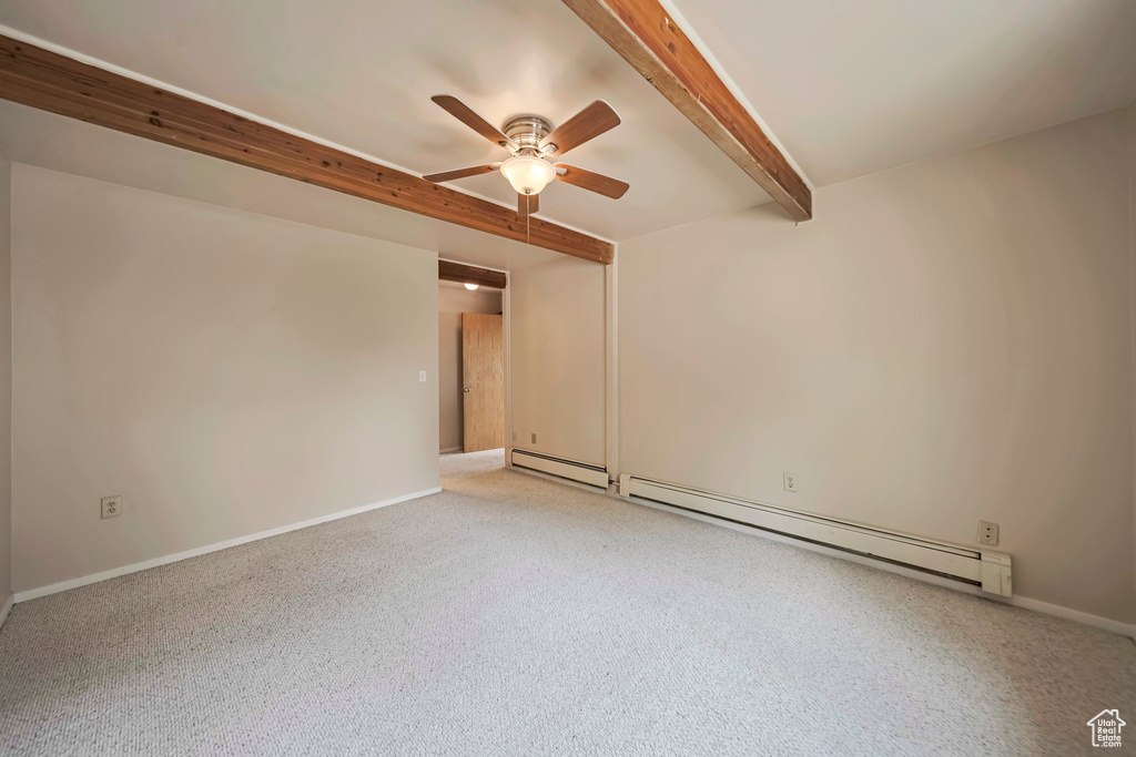 Unfurnished room with a baseboard radiator, ceiling fan, beamed ceiling, a baseboard heating unit, and light colored carpet