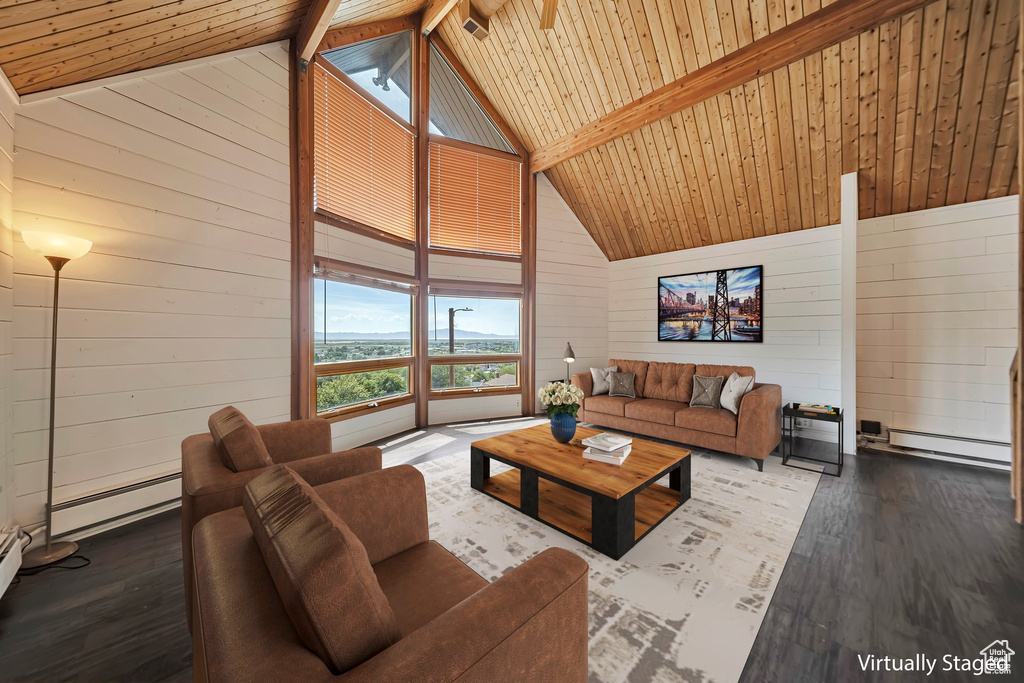 Living area featuring wood walls, a baseboard radiator, hardwood / wood-style floors, wooden ceiling with exposed beams, and high vaulted ceiling