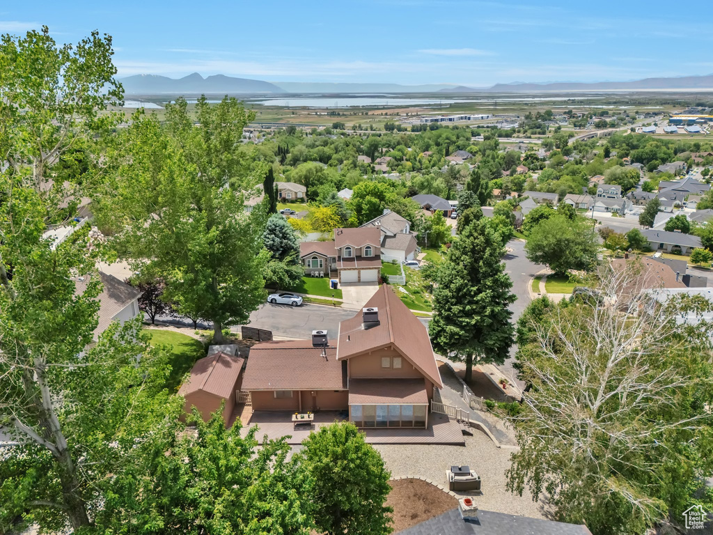 Aerial perspective of suburban area with a mountain backdrop