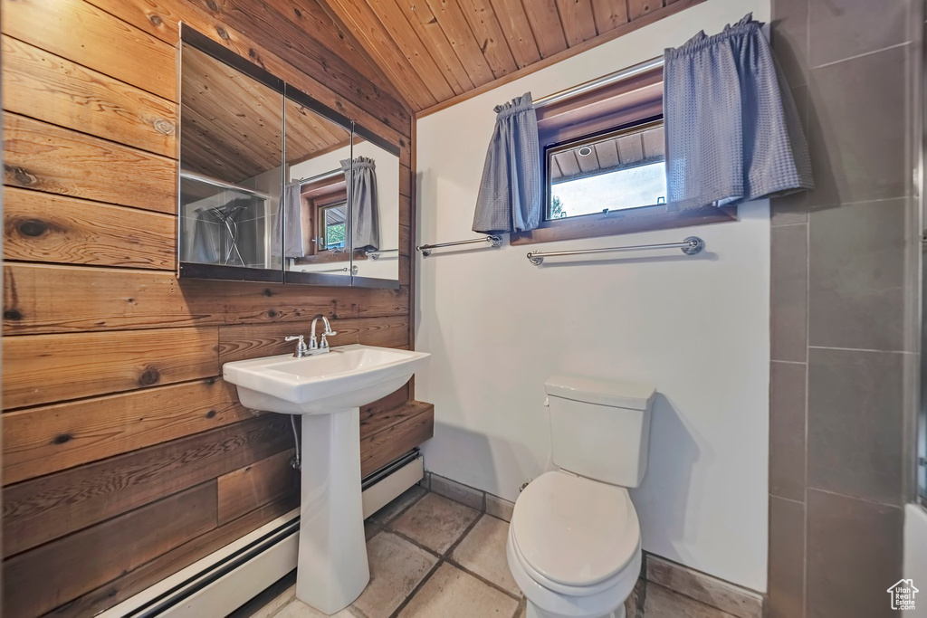 Full bathroom with wooden ceiling, healthy amount of natural light, toilet, a shower, and a baseboard radiator