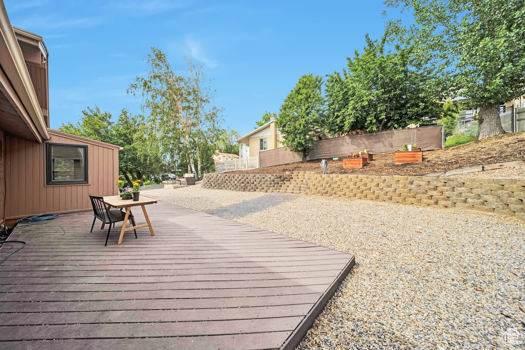 Wooden deck featuring outdoor dining area