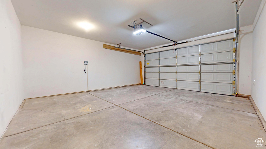 Garage featuring a garage door opener