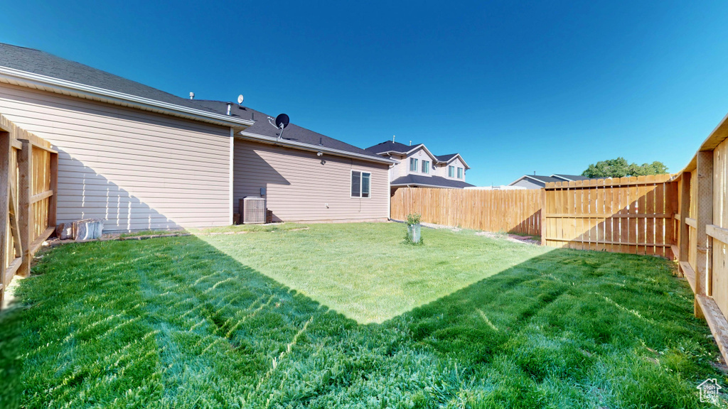 View of yard featuring central air condition unit