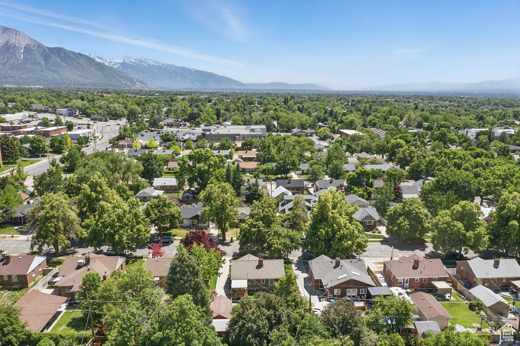 Aerial view of residential area featuring a mountain backdrop