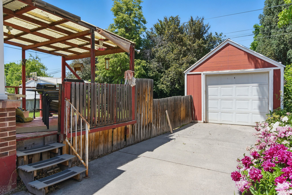 Detached garage featuring driveway