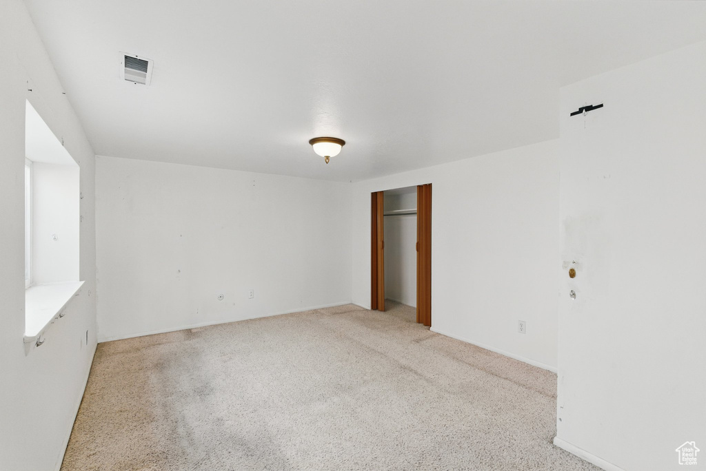 View of carpeted spare room