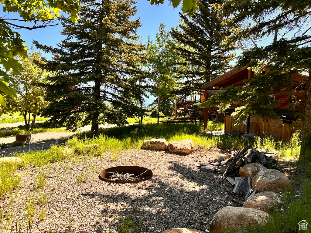 View of yard with a fire pit