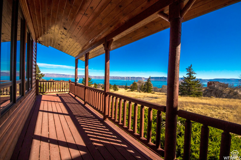 Deck featuring a water and mountain view