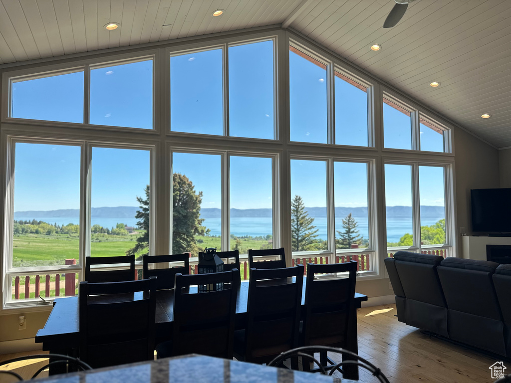 Dining area with wood-type flooring, recessed lighting, high vaulted ceiling, and wood ceiling