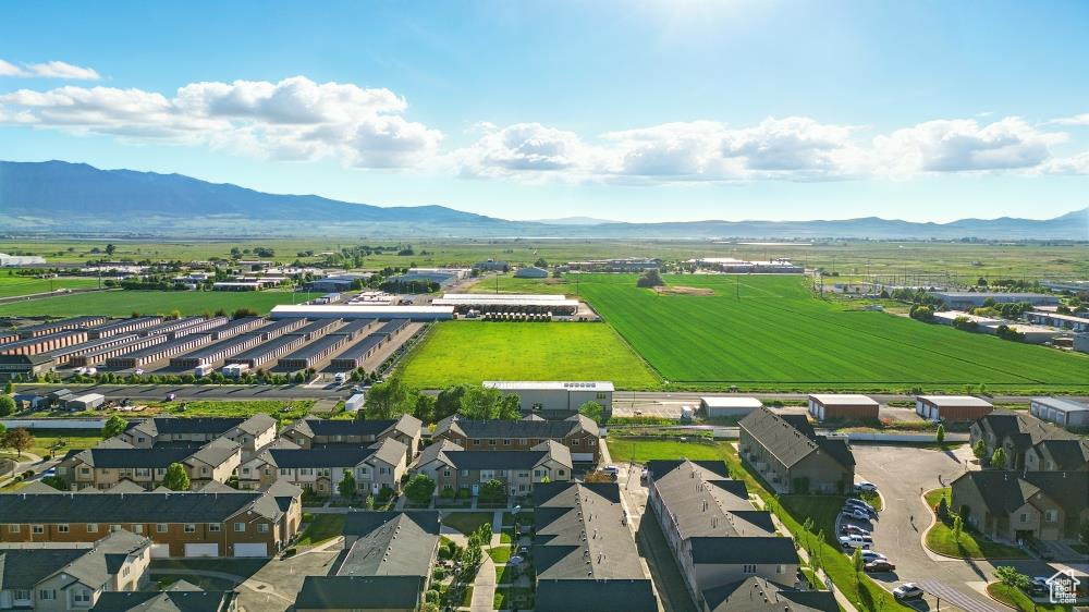 Aerial perspective of suburban area featuring a mountain backdrop