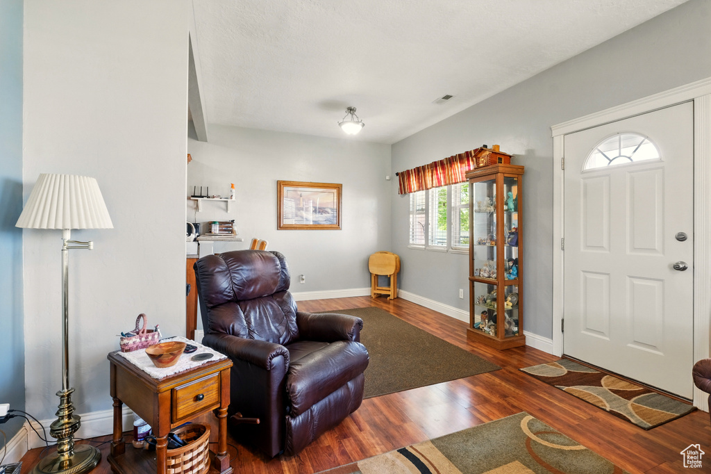 Living room featuring wood finished floors and baseboards