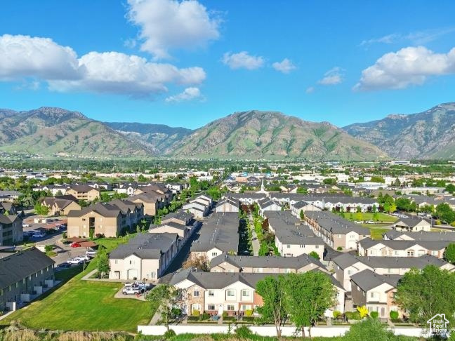 Aerial perspective of suburban area featuring a mountainous background