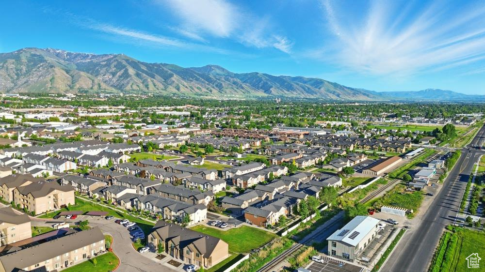 View of property location with a mountain backdrop and nearby suburban area