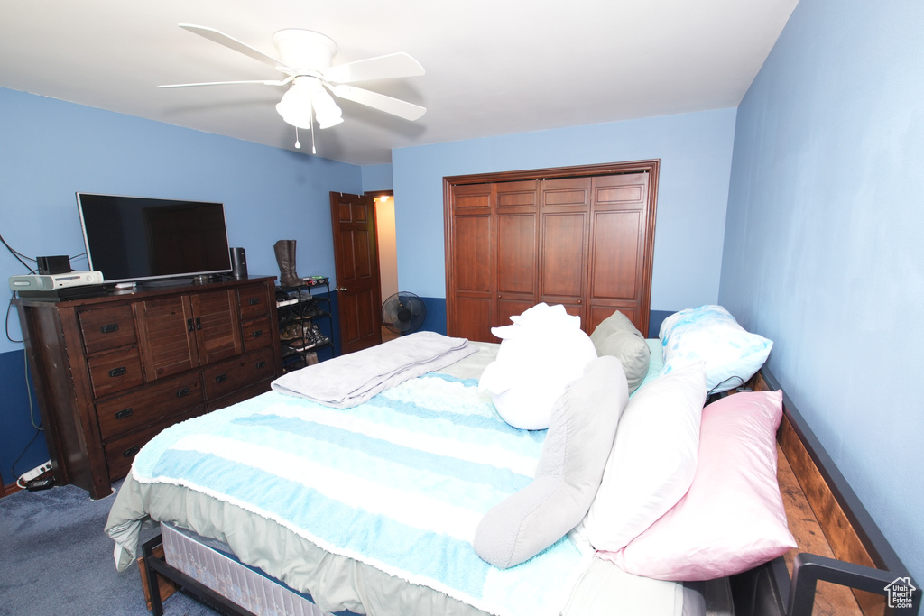Bedroom with a closet, a ceiling fan, and baseboards