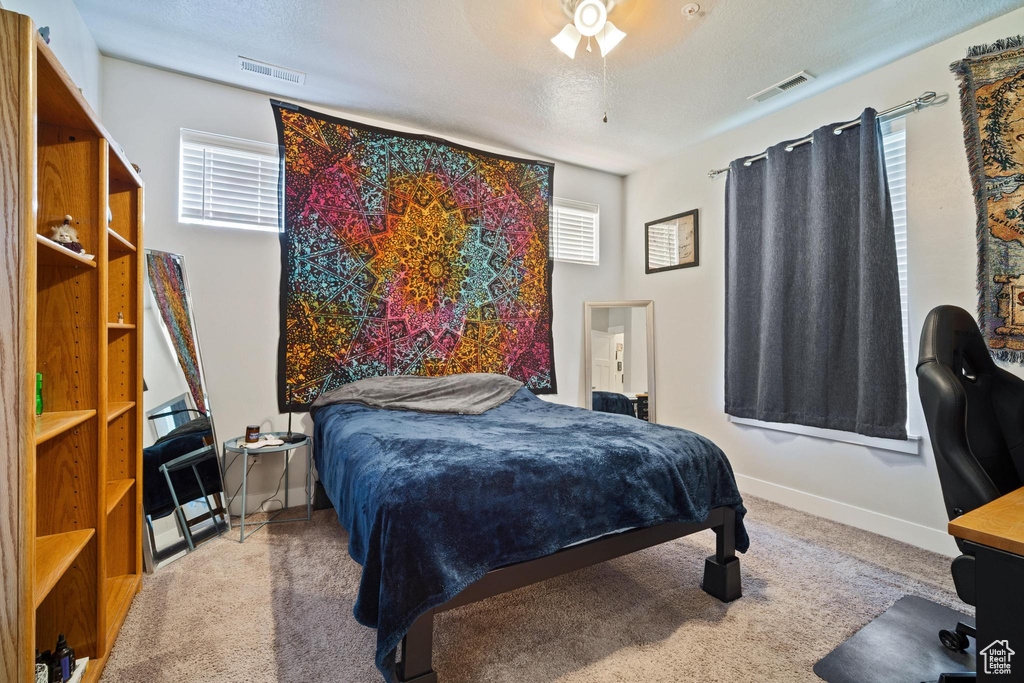 Bedroom with carpet floors and baseboards