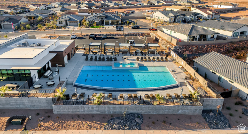 Aerial perspective of suburban area with a pool