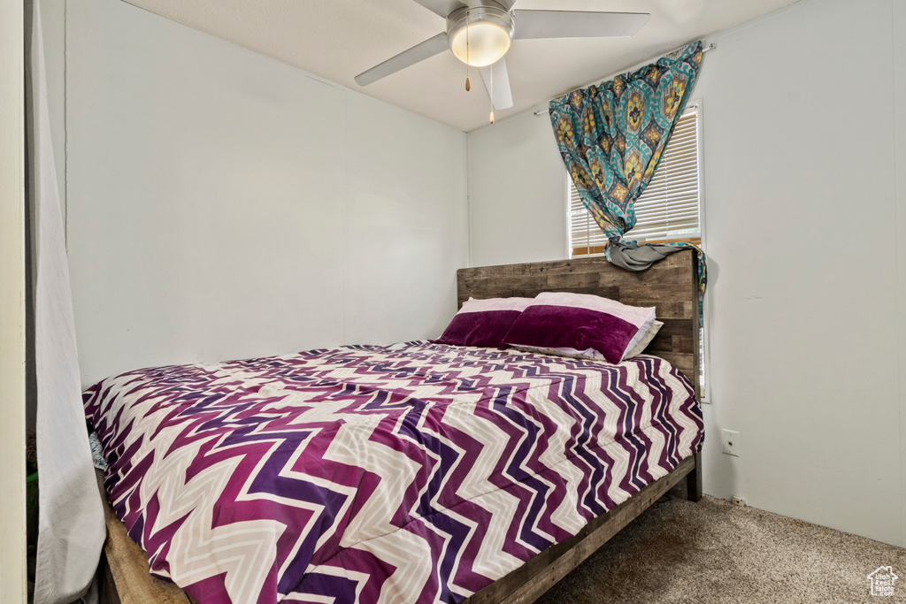 Bedroom featuring carpet flooring and a ceiling fan