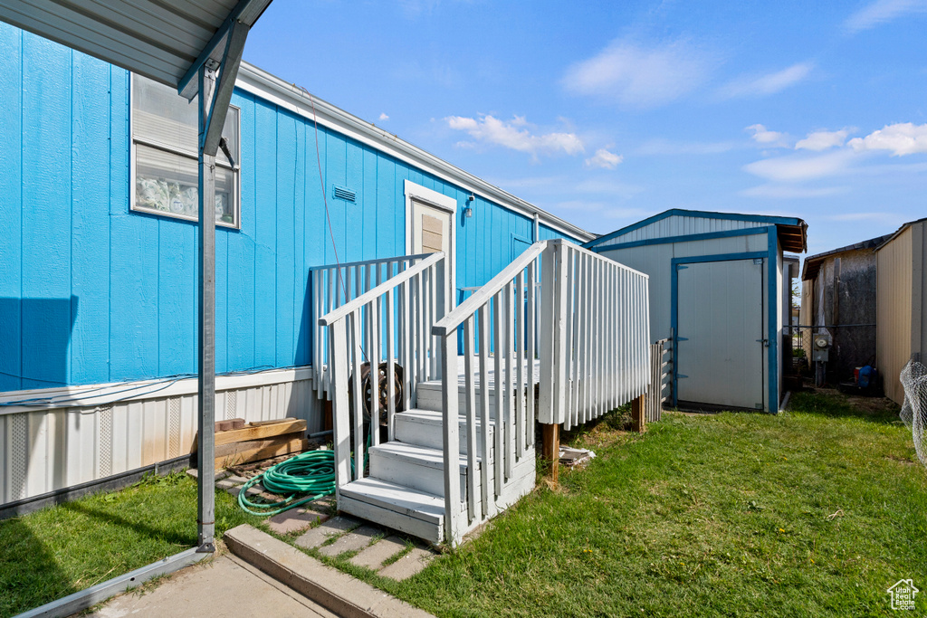 Exterior space featuring a yard