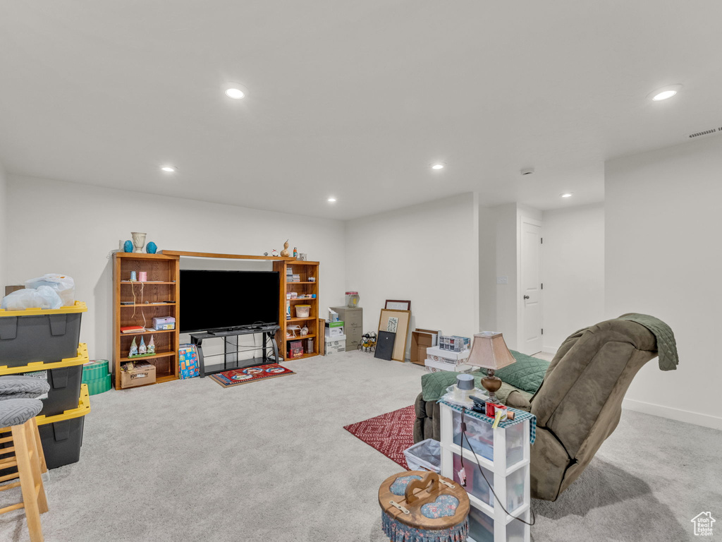 Living room with carpet floors and recessed lighting