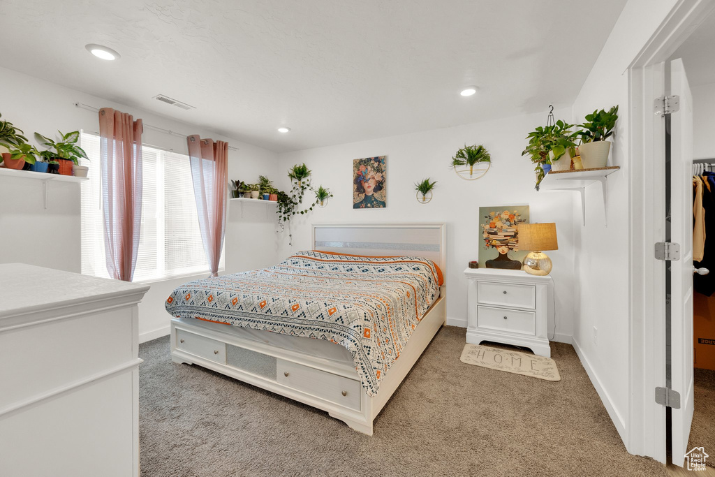Bedroom featuring carpet flooring, recessed lighting, and baseboards