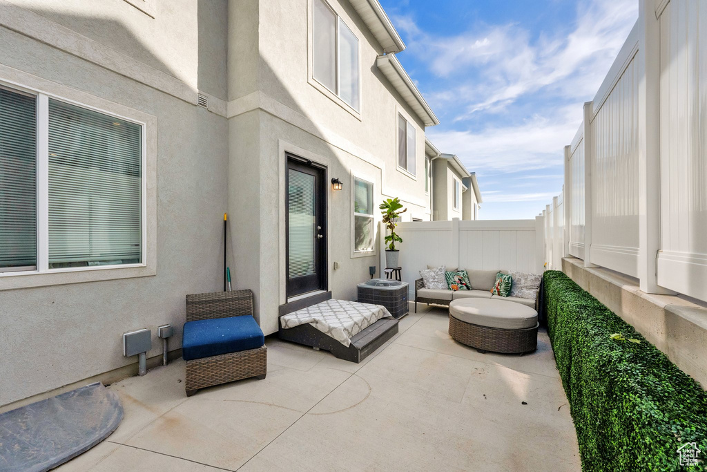 View of patio / terrace with an outdoor hangout area and cooling unit