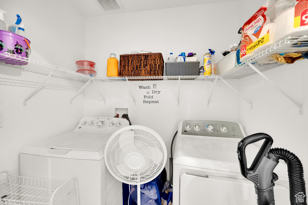Laundry area featuring washing machine and clothes dryer