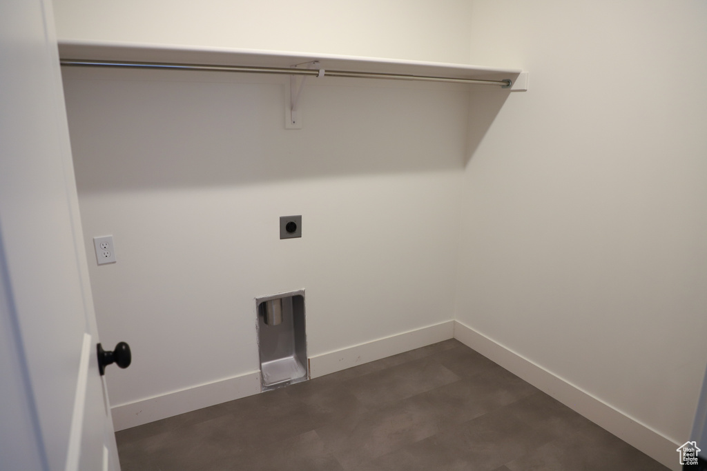 Washroom featuring hookup for an electric dryer and baseboards