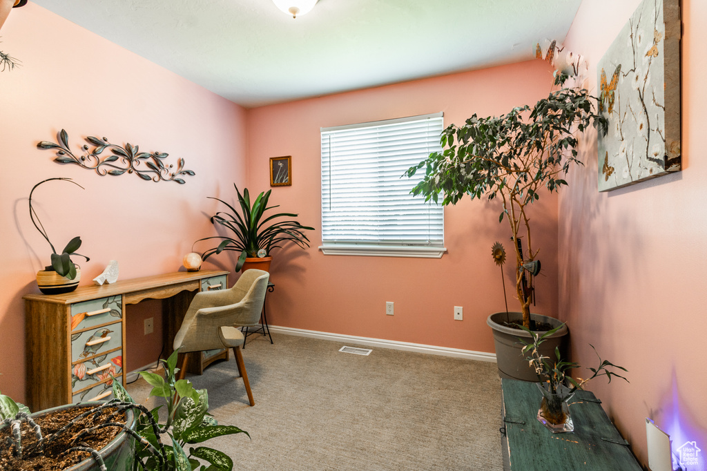 Carpeted office with baseboards