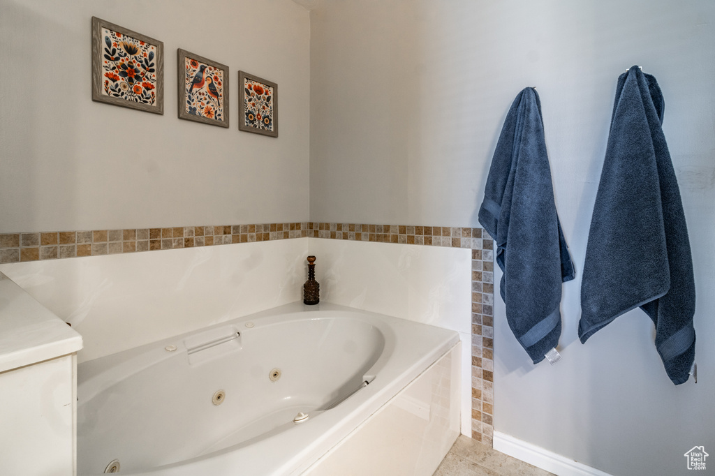Full bathroom featuring a tub with jets