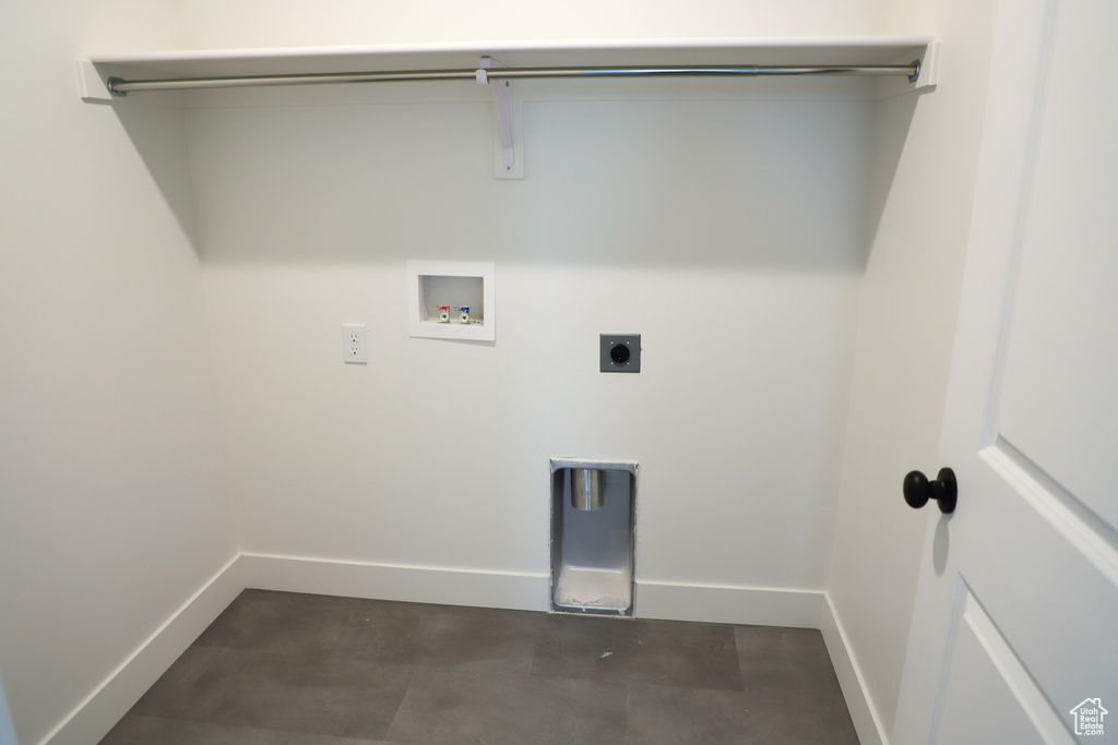 Washroom featuring baseboards, hookup for a washing machine, and hookup for an electric dryer