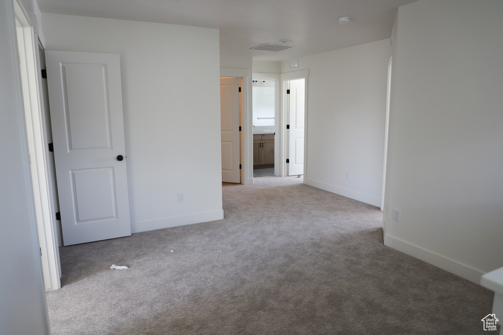 Unfurnished room featuring carpet flooring and baseboards