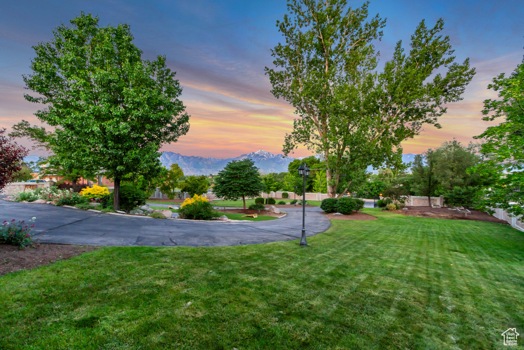 View of grassy yard featuring a mountain view