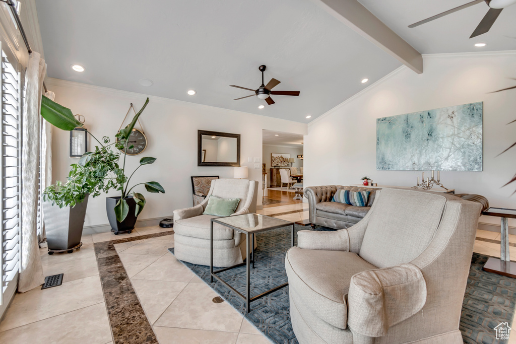 Living room featuring a ceiling fan, recessed lighting, baseboards, light tile patterned floors, and crown molding