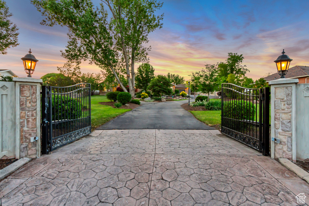 View of road featuring a gate and a gated entry