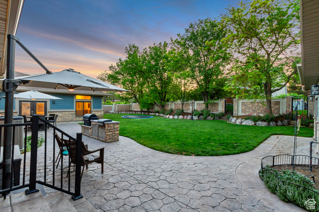 Patio terrace at dusk with a patio area