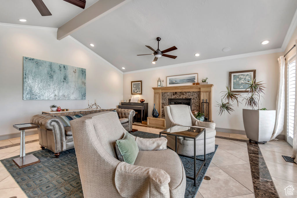 Tiled living room featuring a ceiling fan, ornamental molding, a high end fireplace, recessed lighting, and baseboards