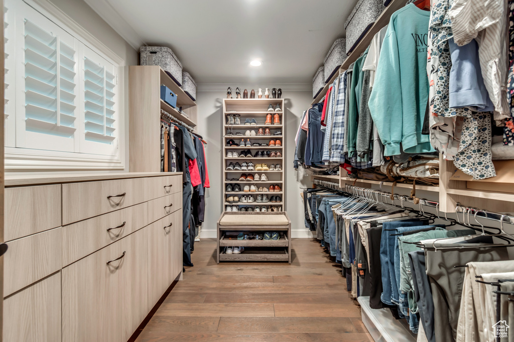 Walk in closet featuring wood finished floors