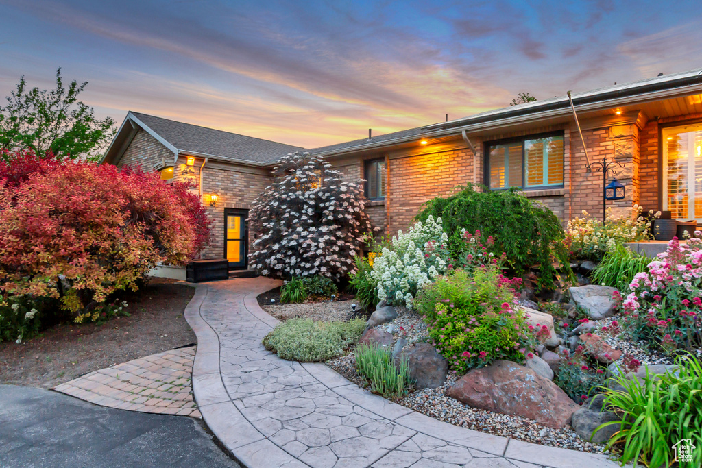 View of front of home featuring brick siding