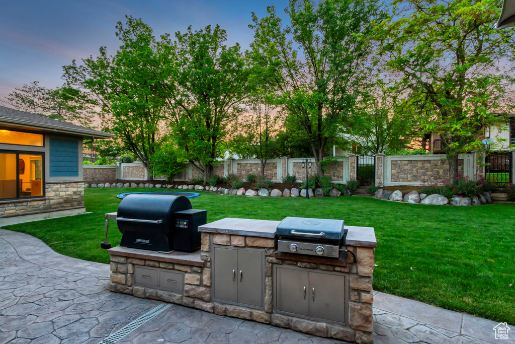 Patio terrace at dusk with a patio area